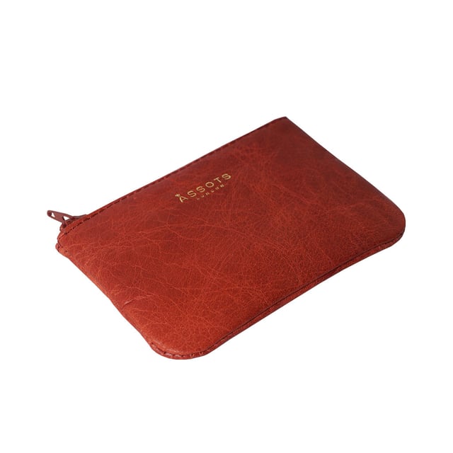 Poppy' Full Grain Leather Zip Top Coin Purse Assots 'Poppy' is a cute mini leather accessory handcrafted to compliment your collection of genuine leather handbags. Its simple and compact design is what makes this leather coin purse super practical and purposeful. Whether you prefer to carry one in lieu of a purse or keep one filled with change tucked inside your handbag, these pretty little things come in assorted colours.
Develops a unique rich patina with use to cherish over the years to come. Secured zip top closure. Embellished with an Assots London golden foil logo in the front. Opens to a fully lined interior in matching colour. Composition: Body: 100% Genuine Leather. Lining: Polyester.
DISCLAIMER : All pictures shown are for illustration purpose only. Actual product colour may vary due to different ambience lighting or the screen display settings. Size- W12cm x H8.5cm x D1cm.