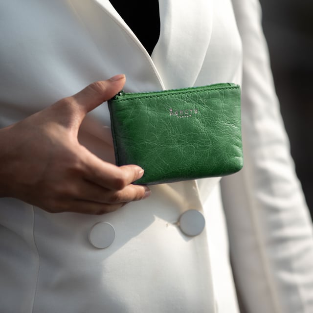 Assots 'Diana' is a cute mini leather accessory handcrafted to compliment your collection of genuine leather handbags. Its simple, compact and t-gusset design is what makes this leather coin purse super practical and purposeful. Whether you prefer to carry one in lieu of a purse or keep one filled with change tucked inside your handbag, these pretty little things come in assorted colours.
Develops a unique rich patina with use to cherish over the years to come. Secured zip top closure. T-gusset design provides extra space. Embellished with an Assots London golden foil logo in the front. Opens to a fully lined interior in matching colour. Composition: Body: 100% Genuine Leather. Lining: Polyester.
DISCLAIMER : All pictures shown are for illustration purpose only. Actual product colour may vary due to different ambience lighting or the screen display settings. Size- W13cm x H8.5cm x D2cm.