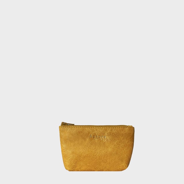 Assots 'Diana' is a cute mini leather accessory handcrafted to compliment your collection of genuine leather handbags. Its simple, compact and t-gusset design is what makes this leather coin purse super practical and purposeful. Whether you prefer to carry one in lieu of a purse or keep one filled with change tucked inside your handbag, these pretty little things come in assorted colours.
Develops a unique rich patina with use to cherish over the years to come. Secured zip top closure. T-gusset design provides extra space. Embellished with an Assots London golden foil logo in the front. Opens to a fully lined interior in matching colour. Composition: Body: 100% Genuine Leather Lining: Polyester.
DISCLAIMER : All pictures shown are for illustration purpose only. Actual product colour may vary due to different ambience lighting or the screen display settings. Size- W13cm x H8.5cm x D2cm.
