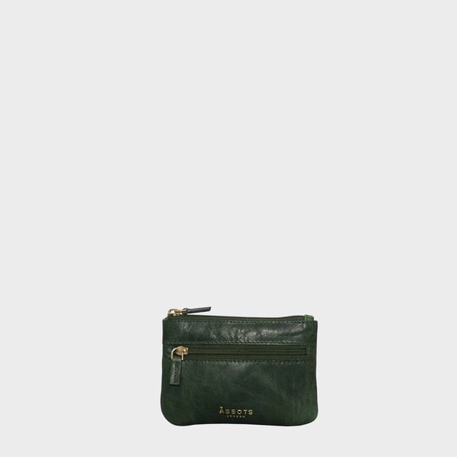 Keep things simple with this small coin purse crafted from super soft and supple natural grain Nappa leather. Featuring a simple compartment that opens along the top, the 'Mary' has a fully lined matching interior that is ideal for the basics. Comes in four more bright colours to spot easily in your bag.
Zip top closure. Zip pocket at the front. Embellished with gold metal zippers and an inimitable Assots London golden foil embossed logo. Fittings: Gold 
Composition: Body: 100% Genuine Leather. Lining: 100% Polyester.
DISCLAIMER : All pictures shown are for illustration purpose only. Actual product colour may vary due to different ambience lighting or the screen display settings. Size- W12.5cm x H9cm.