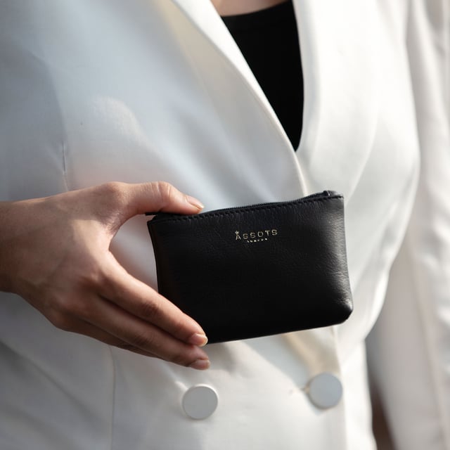 'Diana' Full Grain Leather Zip Top Coin Purse Assots 'Diana' is a cute mini leather accessory handcrafted to compliment your collection of genuine leather handbags. Its simple, compact and t-gusset design is what makes this leather coin purse super practical and purposeful. Whether you prefer to carry one in lieu of a purse or keep one filled with change tucked inside your handbag, these pretty little things come in assorted colours.
Develops a unique rich patina with use to cherish over the years to come. Secured zip top closure. T-gusset design provides extra space. Embellished with an Assots London golden foil logo in the front. Opens to a fully lined interior in matching colour. Composition: Body: 100% Genuine Leather. Lining: Polyester.
DISCLAIMER : All pictures shown are for illustration purpose only. Actual product colour may vary due to different ambience lighting or the screen display settings. Size- W13cm x H8.5cm x D2cm.