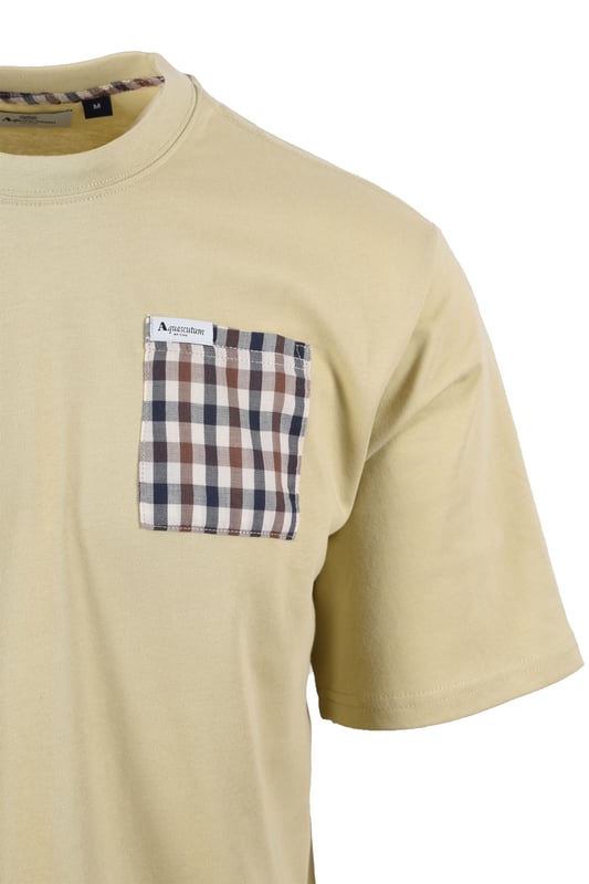 Aquascutum Club Check Pocket T-shirt in Beige
Elevate your casual wardrobe with the Aquascutum Club Check Pocket T-Shirt, crafted for discerning style and sustainable comfort. This beige t-shirt is meticulously made from 100% organic cotton, offering a soft, breathable 180gr/m2 fabric that's gentle on the skin and the environment.
A signature touch of sophistication is delivered through the iconic Aquascutum club check pocket, providing a distinctive contrast against the smooth beige backdrop. A subtly woven logo label on the pocket adds a refined detail, showcasing the brand's heritage.
 
Designed for everyday ease, this t-shirt features a classic crew neck with a durable 1:1 rib knit, short sleeves, and a comfortable regular fit. Whether you're relaxing at home or out for a casual outing, this t-shirt ensures effortless style and lasting comfort.

 
Features

Premium Organic Cotton: Crafted from 100% organic cotton, 180gr/m2, for superior comfort and sustainability.   
Iconic Club Check Pocket: Features a contrasting club check pocket, a hallmark of Aquascutum design.   
Woven Logo Detail: A subtle woven logo label on the pocket adds a touch of brand authenticity.
Classic Crew Neck: Designed with a comfortable 1:1 rib-knit crew neck.   
Regular Fit: This style offers a relaxed and comfortable fit for everyday wear. 
Short Sleeves: Perfect for warm weather or layering.
Style code: AA_B005_TS007