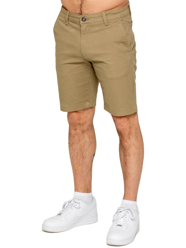 Upgrade your warm-weather wardrobe with the Enzo Men's Chino Shorts, designed for both style and comfort. Featuring a slim fit and crafted from stretch fabric, these shorts offer ease of movement and a sleek look. Practicality meets sophistication with two side slash pockets and two back welt pockets, providing ample storage for your essentials. The zip fly fastening ensures a secure and classic finish. (647)