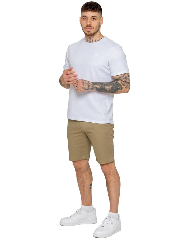 Upgrade your warm-weather wardrobe with the Enzo Men's Chino Shorts, designed for both style and comfort. Featuring a slim fit and crafted from stretch fabric, these shorts offer ease of movement and a sleek look. Practicality meets sophistication with two side slash pockets and two back welt pockets, providing ample storage for your essentials. The zip fly fastening ensures a secure and classic finish. (647)