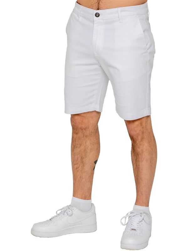 Upgrade your warm-weather wardrobe with the Enzo Men's Chino Shorts, designed for both style and comfort. Featuring a slim fit and crafted from stretch fabric, these shorts offer ease of movement and a sleek look. Practicality meets sophistication with two side slash pockets and two back welt pockets, providing ample storage for your essentials. The zip fly fastening ensures a secure and classic finish. (647)