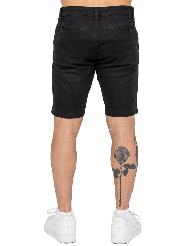 Upgrade your warm-weather wardrobe with the Enzo Men's Chino Shorts, designed for both style and comfort. Featuring a slim fit and crafted from stretch fabric, these shorts offer ease of movement and a sleek look. Practicality meets sophistication with two side slash pockets and two back welt pockets, providing ample storage for your essentials. The zip fly fastening ensures a secure and classic finish. (647)