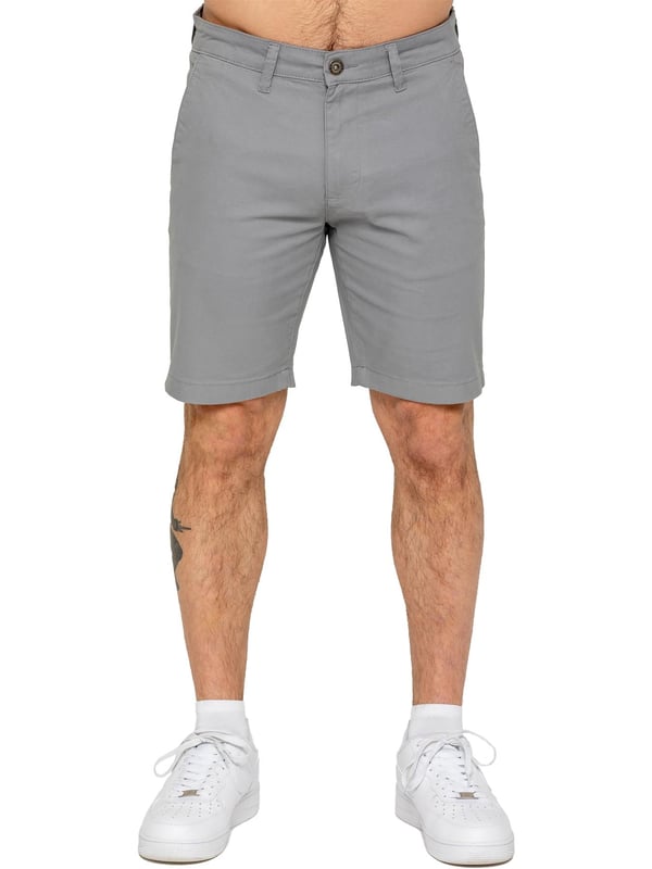 Upgrade your warm-weather wardrobe with the Enzo Men's Chino Shorts, designed for both style and comfort. Featuring a slim fit and crafted from stretch fabric, these shorts offer ease of movement and a sleek look. Practicality meets sophistication with two side slash pockets and two back welt pockets, providing ample storage for your essentials. The zip fly fastening ensures a secure and classic finish. (647)