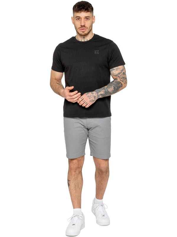 Upgrade your warm-weather wardrobe with the Enzo Men's Chino Shorts, designed for both style and comfort. Featuring a slim fit and crafted from stretch fabric, these shorts offer ease of movement and a sleek look. Practicality meets sophistication with two side slash pockets and two back welt pockets, providing ample storage for your essentials. The zip fly fastening ensures a secure and classic finish. (647)