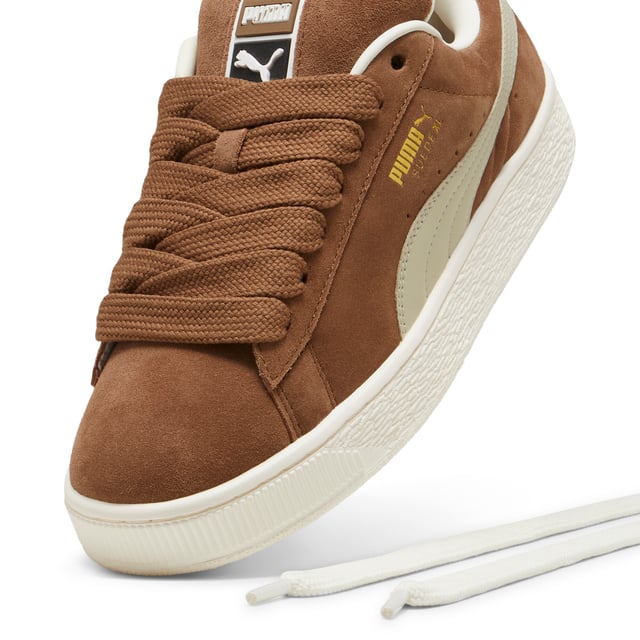 PUMA Unisex Suede XL Sneakers PRODUCT STORY: This fresh take on the classic Suede draws inspiration from PUMA’s heritage within breakdancing and its influence on modern streetwear. The Suede XL retains the Suede’s iconic DNA, but gives it a twist with an exaggerated padded collar and tongue, plus a chunkier sole. This execution features a full suede upper with a leather Formstrip. FEATURES & BENEFITS: PUMA’s leather products support responsible manufacturing via the Leather Working Group.DETAILS: Suede upper; Leather Formstrip; Suede tongue with mesh binding; Debossed and foil-printed PUMA branding on quarter panel; Mesh lining; Mesh sockliner; Rubber midsole; Rubber outsole; Lining: Textile, Other; Outsole: Rubber; Upper: Leather; Sockliner: Textile.