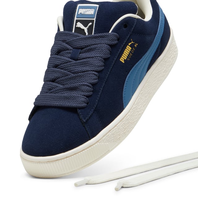 PRODUCT STORY: This fresh take on the classic Suede draws inspiration from PUMA’s heritage within breakdancing and its influence on modern streetwear. The Suede XL retains the Suede’s iconic DNA, but gives it a twist with an exaggerated padded collar and tongue, plus a chunkier sole. This execution features a full suede upper with a leather Formstrip. FEATURES & BENEFITS: PUMA’s leather products support responsible manufacturing via the Leather Working Group.DETAILS: Suede upper; Leather Formstrip; Suede tongue with mesh binding; Debossed and foil-printed PUMA branding on quarter panel; Mesh lining; Mesh sockliner; Rubber midsole; Rubber outsole; Lining: Textile, Other; Outsole: Rubber; Upper: Leather; Sockliner: Textile.