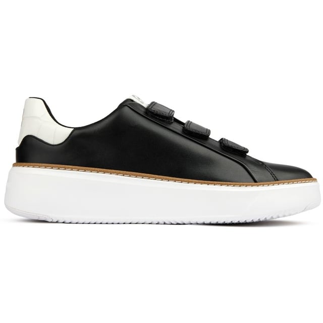 Step up your designer game and don't compromise on comfort and quality. The GrandPrø Topspin court shoe from Cole Haan features a crafted welt that connects an extra-cushioned GRANDFØAM midsole and an anatomical footbed to a luxe leather upper with a triple strap hook and loop closure. These sporty shoes offer superior style, a refined, polished look and comfort.