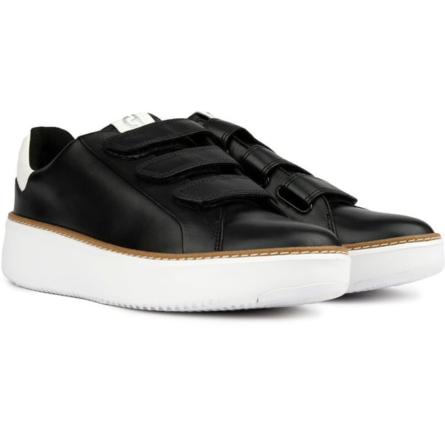 Step up your designer game and don't compromise on comfort and quality. The GrandPrø Topspin court shoe from Cole Haan features a crafted welt that connects an extra-cushioned GRANDFØAM midsole and an anatomical footbed to a luxe leather upper with a triple strap hook and loop closure. These sporty shoes offer superior style, a refined, polished look and comfort.