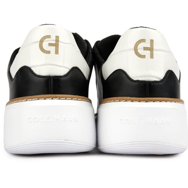 Step up your designer game and don't compromise on comfort and quality. The GrandPrø Topspin court shoe from Cole Haan features a crafted welt that connects an extra-cushioned GRANDFØAM midsole and an anatomical footbed to a luxe leather upper with a triple strap hook and loop closure. These sporty shoes offer superior style, a refined, polished look and comfort.