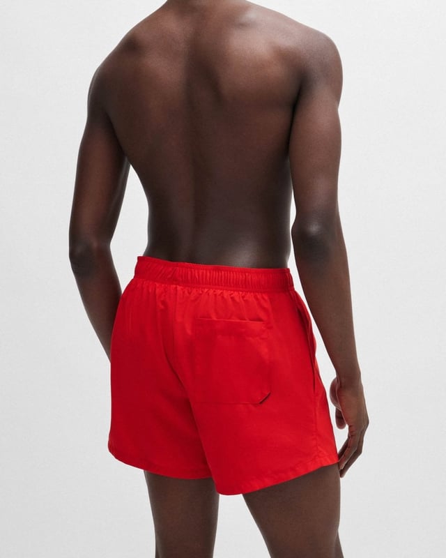 Modern swim shorts by HUGO. Designed in quick-drying fabric with full lining, this beach-ready pair features a vertical logo printed in contrast.
100% Polyester (recycled) , Lining: 100% Polyester
50513979