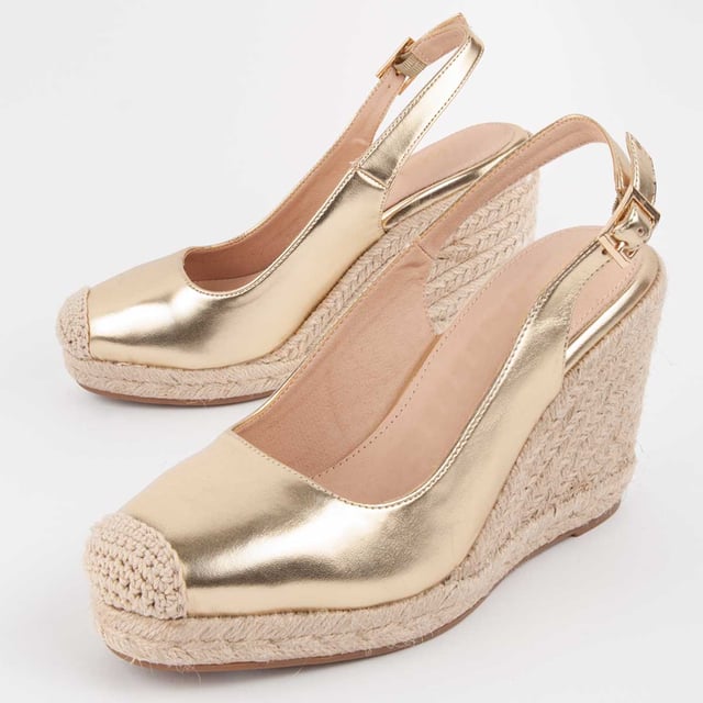 Dames sleehak espadrille. Binnenzool van 100% natuurlijk leer. Comfortabele pasvorm. Gemaakt door andere merken voor ons merk. Geschatte afmetingen: 8 cm hak en 2 cm plateau.