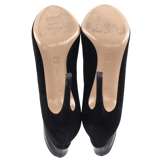 VINTAGE, RRP AS NEW
 The Gianvito Rossi Vamp Peep-Toe Ankle Boots in black suede and leather offer a sophisticated, seductive design with a perfect balance of elegance and edge. These boots feature a sleek silhouette, crafted from smooth black suede with leather detailing, and a daring peep-toe for a hint of allure. The stiletto heel adds a touch of height and sophistication, while the ankle-high design ensures a flattering, elongating effect on the legs. A must-have for the modern woman, these boots bring both versatility and luxury to your footwear collection.

Styling Tip:
Pair these chic ankle boots with a figure-hugging midi dress for an ultra-feminine, elegant look. For a more edgy style, wear them with skinny leather pants and an oversized blazer. The black suede and leather design makes these boots incredibly versatile, complementing both eveningwear and more casual outfits, giving you the perfect combination of style and sophistication for any occasion.

Gianvito Rossi Vamp Peep-Toe Ankle Boots in Black Suede and Leather

Condition: Very good
Signs of wear: Minor markings, Lightly used but very well maintained. Minor mark at soles & creasing, light scuffing at the soles and heels.
Packaging: None
Color: Black
Material:  Suede
Size: IT | 38
Measurements: Heel height: 90; Insole length: 200
SKU: NAPPUGBSH457554W