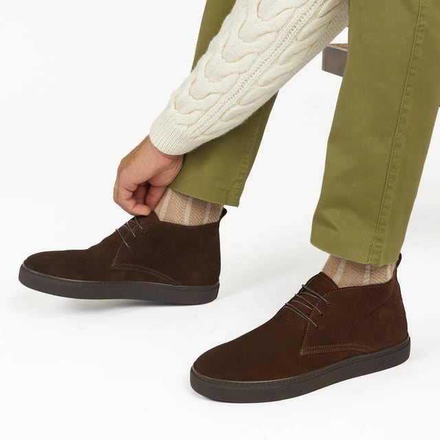 Chukka boots started out as a practical option for soldiers in the desert, these days the chukka fulfils the demands of every off-duty pursuit. Lightweight and equipped with a hardy Italian rubber sole, Sullivan features a high-cut profile crafted with supple suede, showcasing a traditional three eye-let lace-up and full leather linings, comfortable and versatile enough to serve you from work to weekend.

We recommend if you are between sizes to select the smaller than your usual.