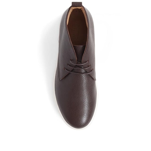 Chukka boots started out as a practical option for soldiers in the desert, these days the chukka fulfils the demands of every off-duty pursuit. Lightweight and equipped with a hardy Italian rubber sole, Sullivan features a high-cut profile crafted with supple suede, showcasing a traditional three eye-let lace-up and full leather linings, comfortable and versatile enough to serve you from work to weekend.

We recommend if you are between sizes to select the smaller than your usual.