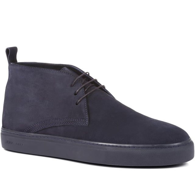 Chukka boots started out as a practical option for soldiers in the desert, these days the chukka fulfils the demands of every off-duty pursuit. Lightweight and equipped with a hardy Italian rubber sole, Sullivan features a high-cut profile crafted with supple suede, showcasing a traditional three eye-let lace-up and full leather linings, comfortable and versatile enough to serve you from work to weekend.

We recommend if you are between sizes to select the smaller than your usual.