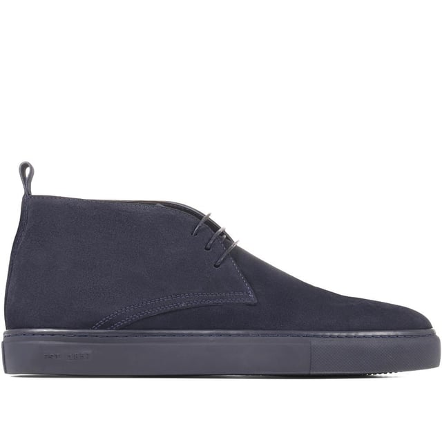 Chukka boots started out as a practical option for soldiers in the desert, these days the chukka fulfils the demands of every off-duty pursuit. Lightweight and equipped with a hardy Italian rubber sole, Sullivan features a high-cut profile crafted with supple suede, showcasing a traditional three eye-let lace-up and full leather linings, comfortable and versatile enough to serve you from work to weekend.

We recommend if you are between sizes to select the smaller than your usual.