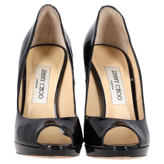 VINTAGE, RRP AS NEW
Jimmy Choo Peep-Toe High Heels in Black Patent Leather – The Perfect Blend of Elegance and Edge

The Jimmy Choo Peep-Toe High Heels in black patent leather are a luxurious addition to any wardrobe. With their sleek, high-shine finish and sophisticated peep-toe design, these heels exude timeless elegance while adding a touch of daring flair. The polished black patent leather gives them an ultra-chic appeal, while the sculpted heel offers both height and comfort. Whether you're attending a special event or enjoying a night out, these heels elevate any outfit with ease.

Jimmy Choo Peep-Toe High Heels in Black Patent Leather
Condition: Very good
Signs of wear: Lightly used but very well maintained. Minor mark at soles & creasing, light scuffing at the soles and heels., Minor markings
Packaging: None
Color: Black 
Material: Leather | patent leather
Size: EU | 38
Measurements: Heel height: 120; Insole length: 280
SKU: NAPPUGBSH460663W