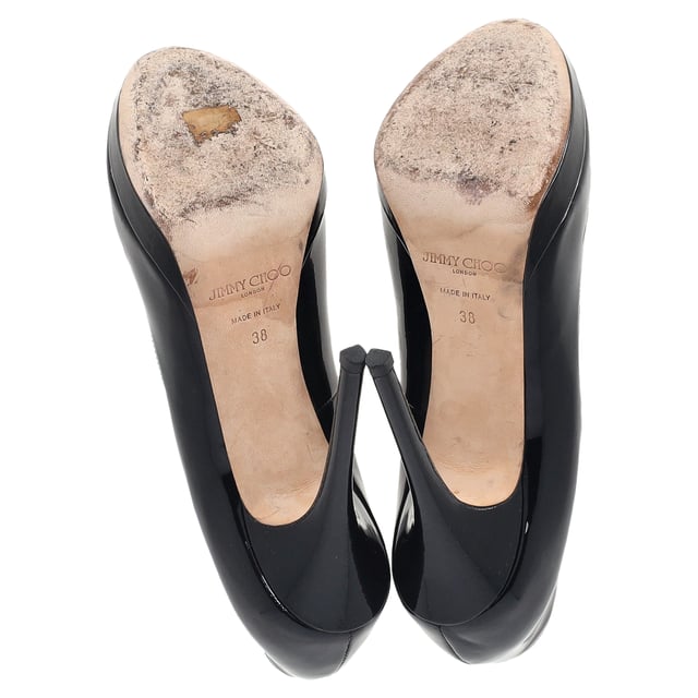 VINTAGE, RRP AS NEW
Jimmy Choo Peep-Toe High Heels in Black Patent Leather – The Perfect Blend of Elegance and Edge

The Jimmy Choo Peep-Toe High Heels in black patent leather are a luxurious addition to any wardrobe. With their sleek, high-shine finish and sophisticated peep-toe design, these heels exude timeless elegance while adding a touch of daring flair. The polished black patent leather gives them an ultra-chic appeal, while the sculpted heel offers both height and comfort. Whether you're attending a special event or enjoying a night out, these heels elevate any outfit with ease.

Jimmy Choo Peep-Toe High Heels in Black Patent Leather
Condition: Very good
Signs of wear: Lightly used but very well maintained. Minor mark at soles & creasing, light scuffing at the soles and heels., Minor markings
Packaging: None
Color: Black 
Material: Leather | patent leather
Size: EU | 38
Measurements: Heel height: 120; Insole length: 280
SKU: NAPPUGBSH460663W