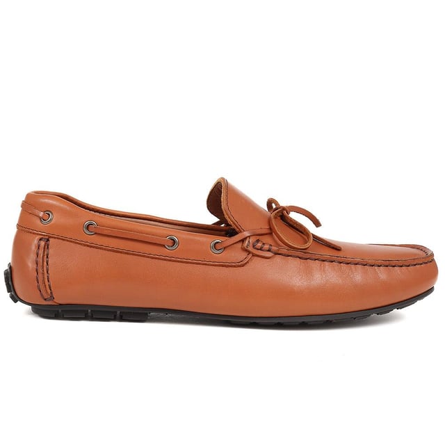 Discover the epitome of luxury with our exquisite leather moccasins, meticulously crafted from premium leather to provide unparalleled comfort and sophistication. These timeless slip-on shoes boast a streamlined silhouette and supple leather lining, making them the ideal choice for those seeking both style and refinement.