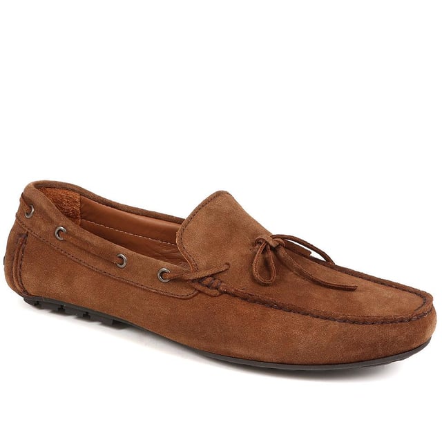 Discover the epitome of luxury with our exquisite leather moccasins, meticulously crafted from premium leather to provide unparalleled comfort and sophistication. These timeless slip-on shoes boast a streamlined silhouette and supple leather lining, making them the ideal choice for those seeking both style and refinement.