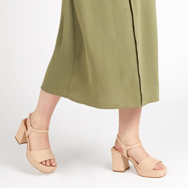 Giuseppa are our statement platform heels, a non-negotiable for occasion wardrobes. Poised on a perfectly balanced suede-covered platform sole, Giuseppa's straps are cut from the softest suede for a chunky, sculpted appearance. Imagined with a vintage-inspired soft square toe, the heeled sandals are fastened by a simple strap at the ankle and lined with a luxe leather footbed for a comfortable finish.