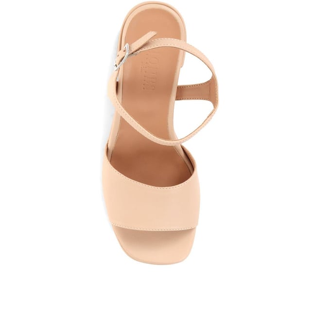 Giuseppa are our statement platform heels, a non-negotiable for occasion wardrobes. Poised on a perfectly balanced suede-covered platform sole, Giuseppa's straps are cut from the softest suede for a chunky, sculpted appearance. Imagined with a vintage-inspired soft square toe, the heeled sandals are fastened by a simple strap at the ankle and lined with a luxe leather footbed for a comfortable finish.