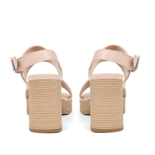 Step back in time with the Diona platform sandals and embrace the 70s vibe. Made from soft leather, this sandal features crossing straps, an ankle strap with a buckle fastening, and a chunky platform sole with a comfortable block heel. Whether it's a special occasion or a night out, these sandals will elevate your look with effortless style and comfort.