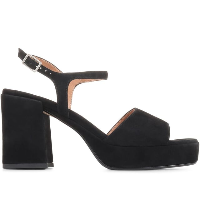 Giuseppa are our statement platform heels, a non-negotiable for occasion wardrobes. Poised on a perfectly balanced suede-covered platform sole, Giuseppa's straps are cut from the softest suede for a chunky, sculpted appearance. Imagined with a vintage-inspired soft square toe, the heeled sandals are fastened by a simple strap at the ankle and lined with a luxe leather footbed for a comfortable finish.