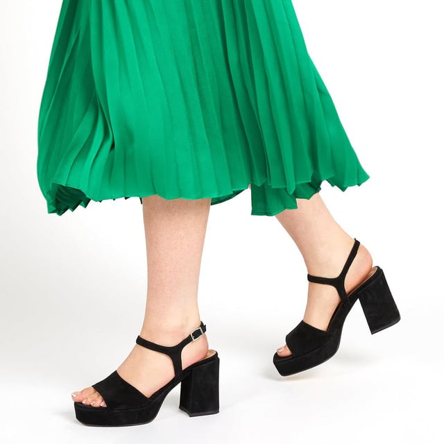 Giuseppa are our statement platform heels, a non-negotiable for occasion wardrobes. Poised on a perfectly balanced suede-covered platform sole, Giuseppa's straps are cut from the softest suede for a chunky, sculpted appearance. Imagined with a vintage-inspired soft square toe, the heeled sandals are fastened by a simple strap at the ankle and lined with a luxe leather footbed for a comfortable finish.