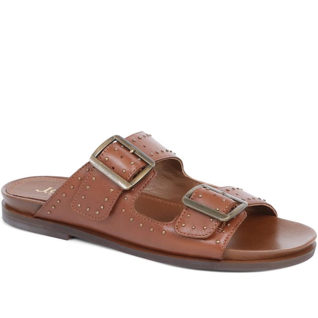 Introducing the ultimate pair of ladies casual mule sandals, perfect for those who like to keep their style effortless yet elegant. Crafted from premium leather and adorned with silver studded embellishments, these sandals will step you through any day to night look.
