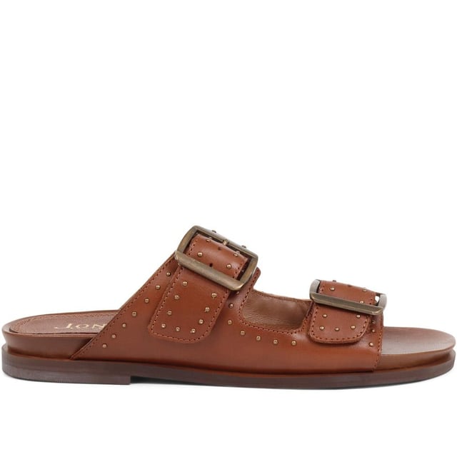 Introducing the ultimate pair of ladies casual mule sandals, perfect for those who like to keep their style effortless yet elegant. Crafted from premium leather and adorned with silver studded embellishments, these sandals will step you through any day to night look.