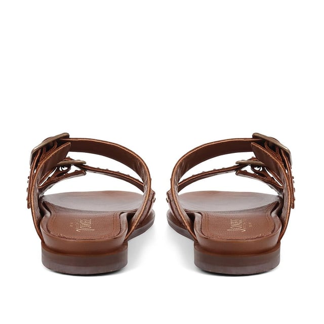 Introducing the ultimate pair of ladies casual mule sandals, perfect for those who like to keep their style effortless yet elegant. Crafted from premium leather and adorned with silver studded embellishments, these sandals will step you through any day to night look.