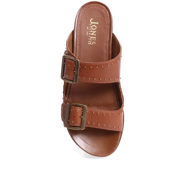 Introducing the ultimate pair of ladies casual mule sandals, perfect for those who like to keep their style effortless yet elegant. Crafted from premium leather and adorned with silver studded embellishments, these sandals will step you through any day to night look.