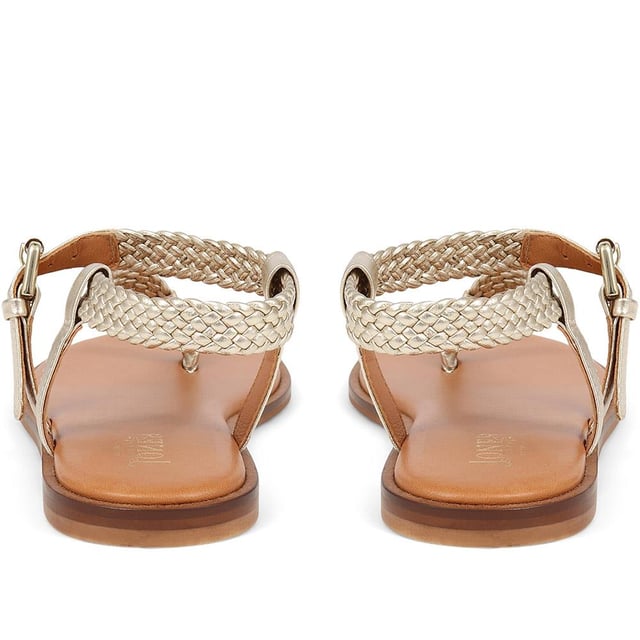 Slide into our leather toe-post sandals, where the simplicity of a flat sole meets intricate charm. Perfect for those balmy days and breezy evenings, they blend effortless style with a hint elegance.
