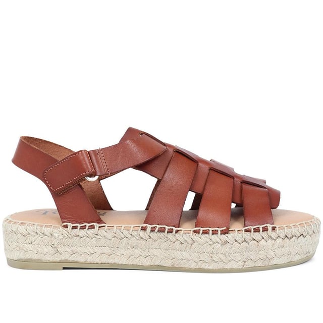 Step out with supreme summer style on your side with these Belisa flatform sandals, easily dressed up or down for dressy or casual occasions alike. Allow a multitude of quality leather straps to encase the foot, leaving enough room to be breathable and comfortable in the summer heat.