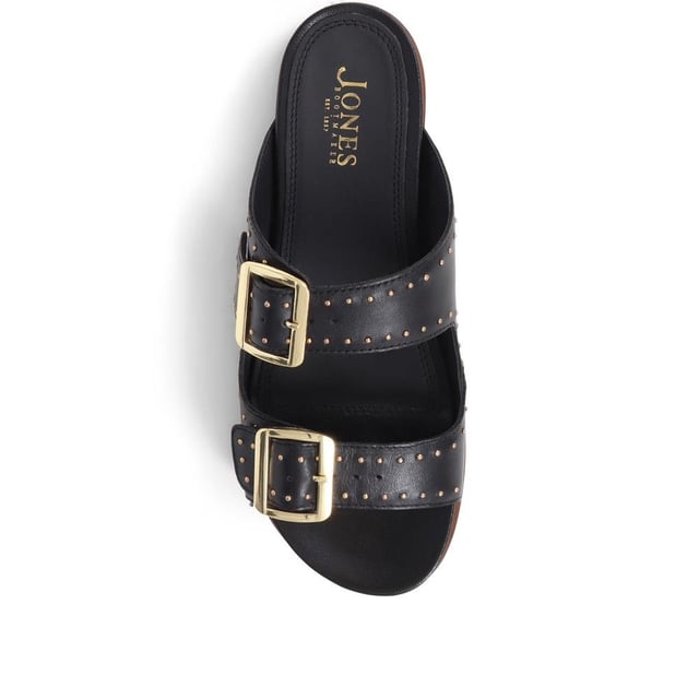 Introducing the ultimate pair of ladies casual mule sandals, perfect for those who like to keep their style effortless yet elegant. Crafted from premium leather and adorned with silver studded embellishments, these sandals will step you through any day to night look.