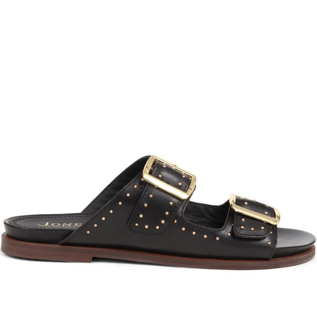 Introducing the ultimate pair of ladies casual mule sandals, perfect for those who like to keep their style effortless yet elegant. Crafted from premium leather and adorned with silver studded embellishments, these sandals will step you through any day to night look.