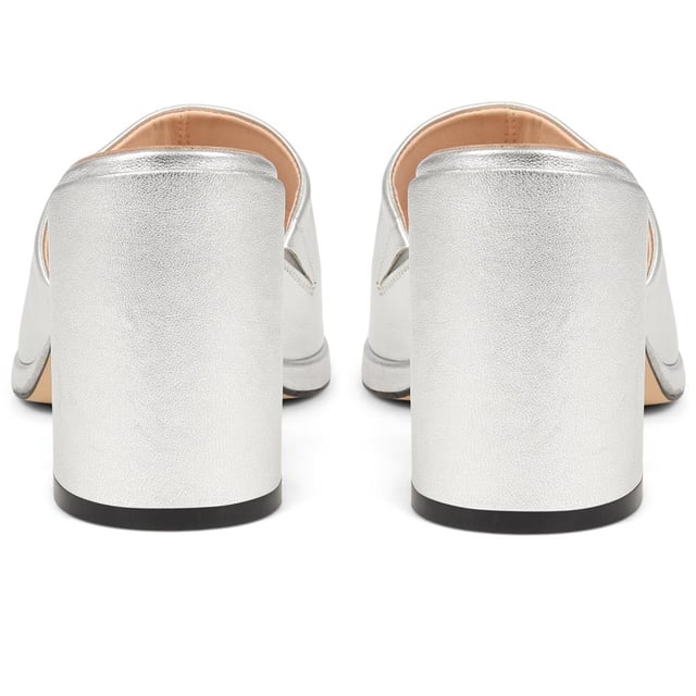 Slip into something a little more sophisticated with these leather mule sandals, boasting a luxurious suede upper and a just-right mid-height block heel. Perfect for weddings and elegant gatherings, these mules blend classic charm with contemporary chic, ensuring you step out in style.
