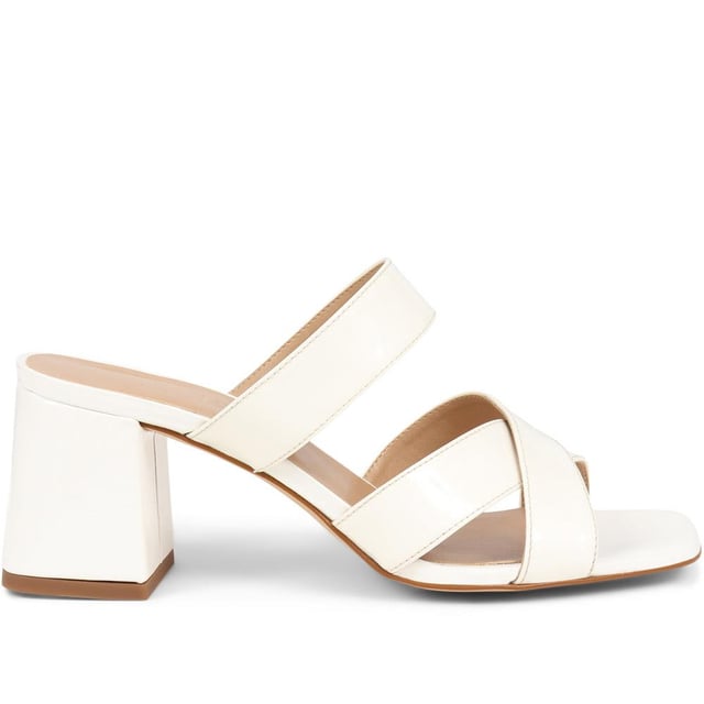 Stride with confidence in our slip-on mule sandals, featuring a chunky block heel that combines comfort with a touch of modern flair. These easy-to-wear mules are the perfect choice for adding a bold statement to your outfit, whether you're dressing up for a special occasion or simply elevating your everyday look.