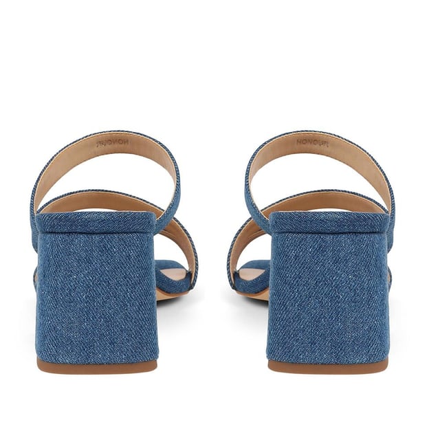 Step out with a playful twist in these heeled mule sandals, featuring crisscross straps and a chunky heel for a casual yet elevated look. Perfect for adding a dash of fun to your step, they're a versatile choice for brunches to evening dates.