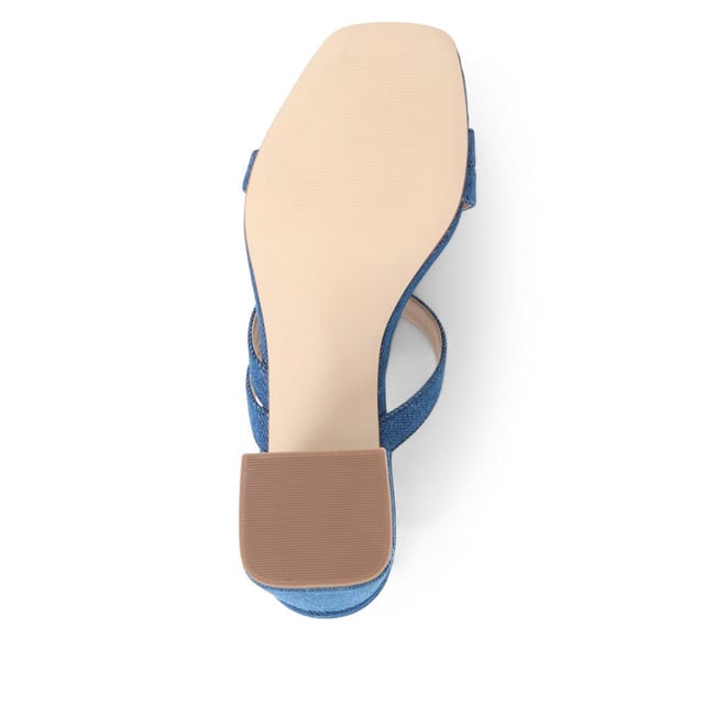 Step out with a playful twist in these heeled mule sandals, featuring crisscross straps and a chunky heel for a casual yet elevated look. Perfect for adding a dash of fun to your step, they're a versatile choice for brunches to evening dates.