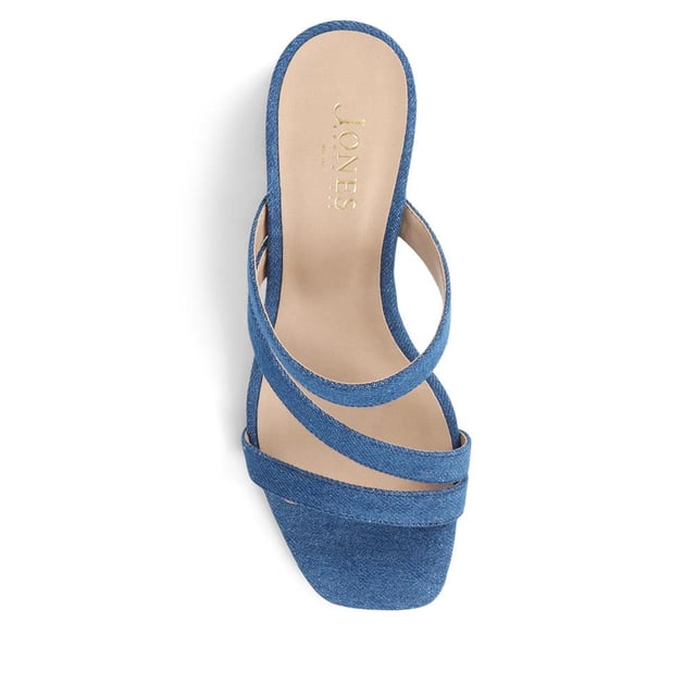 Step out with a playful twist in these heeled mule sandals, featuring crisscross straps and a chunky heel for a casual yet elevated look. Perfect for adding a dash of fun to your step, they're a versatile choice for brunches to evening dates.