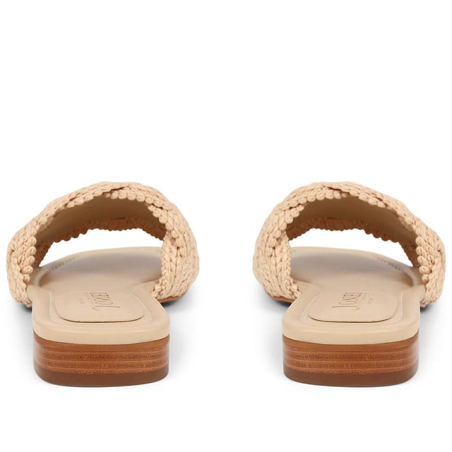 Slide into the textured embrace of these woven slide sandals, and channel artisanal charm and understated elegance. These are your go-to for a relaxed yet polished look that carries you through the summer with ease.