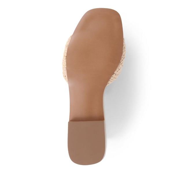 Slide into the textured embrace of these woven slide sandals, and channel artisanal charm and understated elegance. These are your go-to for a relaxed yet polished look that carries you through the summer with ease.