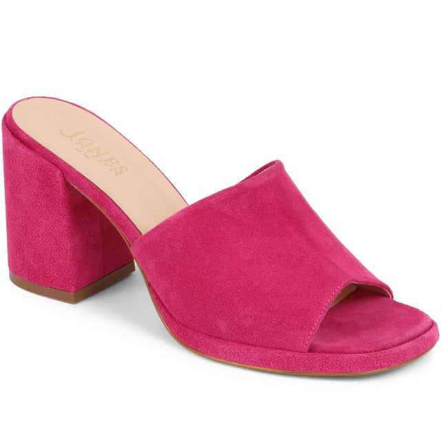 Slip into something a little more sophisticated with these leather mule sandals, boasting a luxurious suede upper and a just-right mid-height block heel. Perfect for weddings and elegant gatherings, these mules blend classic charm with contemporary chic, ensuring you step out in style.