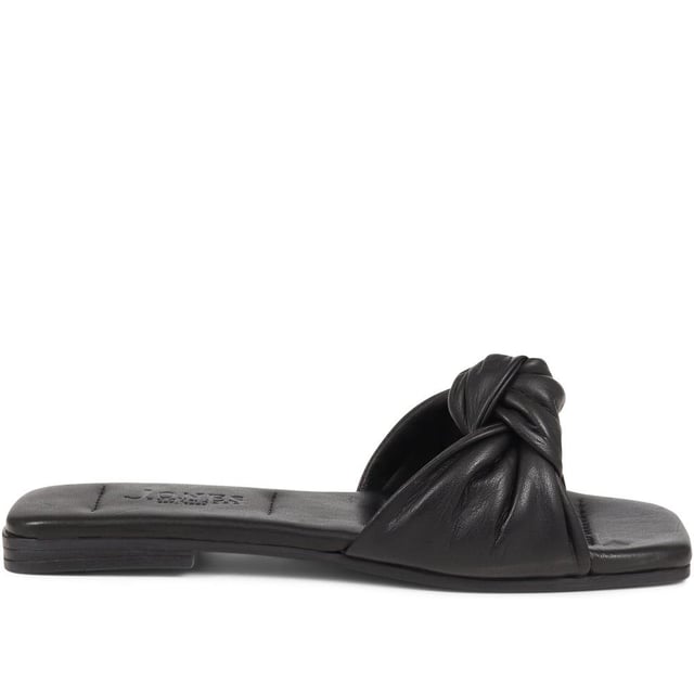 Spend summer with our Madelena mules. With their sleek leather design, cushioned footbed, and daringly minimalist silhouette, they're the perfect blend of elegance and simplicity.